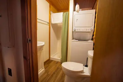 a small bathroom with a toilet and a sink at Diamond Creek | Sleeps up to 6 in Gallipolis