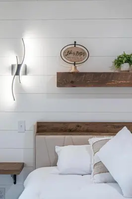 a bedroom with a bed and a sign on the wall at Luxe Studio in Millersburg