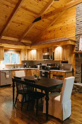 a kitchen with a table and chairs in a room at 
