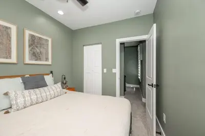 a bedroom with a bed and an open door at The Baymiller Row - For 6 in Cincinnati
