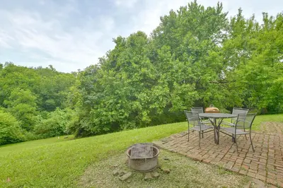 a table and chairs sitting on a brick patio at 3 Mi to River 11-Acre Retreat in Rural Stockport in Chesterhill