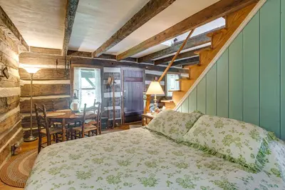 a bedroom with a bed and a table and chairs at 3 Mi to River 11-Acre Retreat in Rural Stockport in Chesterhill