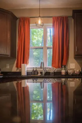 a kitchen with a sink and a window at Modern 2 BD cabin with hot tub & Games & Central Loc in Rockbridge