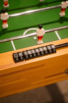 a remote control sitting on top of a pool table at Modern 2 BD cabin with hot tub & Games & Central Loc in Rockbridge