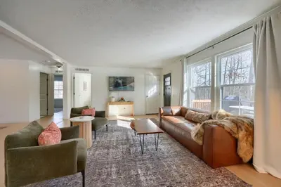 a living room with a couch and two chairs at Buckingham Woods I Hocking Hills in Logan