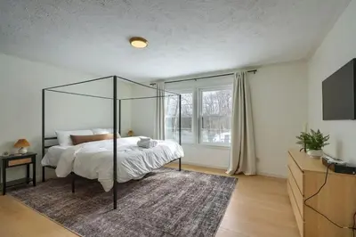 a bedroom with a bed with a glass canopy at Buckingham Woods I Hocking Hills in Logan