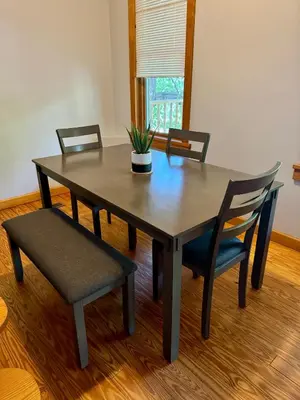 a dining room table with chairs and a potted plant on it at Jungle House Luxury Stays - Columbus Downtown Short North in Columbus