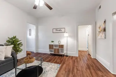 a living room with a couch and a table at Entire Duplex - 2 Units in Columbus