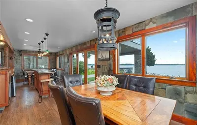 a dining room with a table and chairs at Waterfront Luxury Family Retreat in Sandusky
