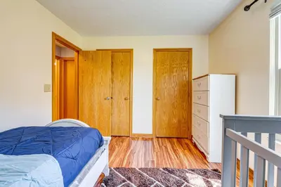 a bedroom with a bed and a dresser at Families Welcome Lake-View Home, 2 Mi to Gahanna! in Columbus