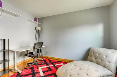 a room with a desk and a chair and a table at Families Welcome Lake-View Home, 2 Mi to Gahanna! in Columbus