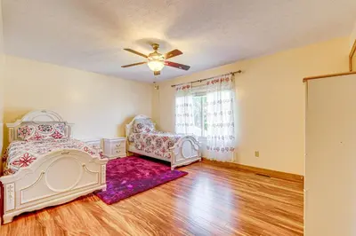 a bedroom with two beds and a ceiling fan at Families Welcome Lake-View Home, 2 Mi to Gahanna! in Columbus