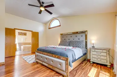 a bedroom with a bed and a ceiling fan at Families Welcome Lake-View Home, 2 Mi to Gahanna! in Columbus