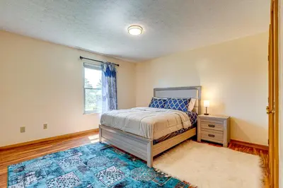 a bedroom with a bed and a window at Families Welcome Lake-View Home, 2 Mi to Gahanna! in Columbus
