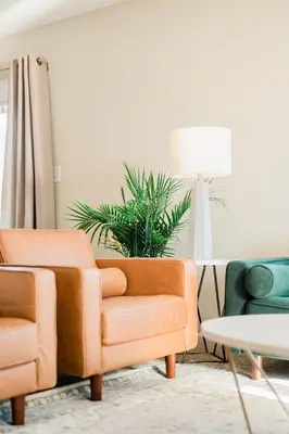 a living room with two chairs and a table at The Estate on 68 AND Pet Friendly in Springfield
