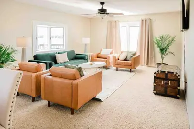 a large living room with couches and chairs at The Estate on 68 AND Pet Friendly in Springfield