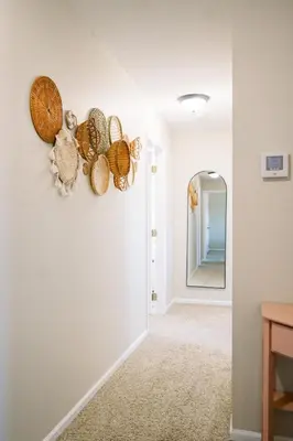 a hallway with shells on the wall and a mirror at The Estate on 68 AND Pet Friendly in Springfield