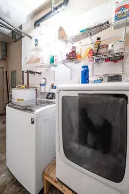 a kitchen with a stove and a microwave at Collins Avenue Duplex – 2 Homes in Columbus