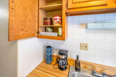 a kitchen with a sink and a counter top at Paws & Peace Cozy 1BR Ground Flr Gem in Dayton in Dayton