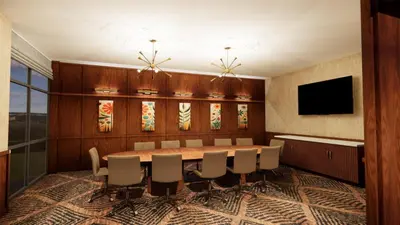 a conference room with a table and chairs at The Hotel Rambler Montgomery, Tapestry Collection By Hilton