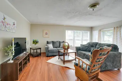 a living room with a couch and a table at Charming and Convenient Home in Butler
