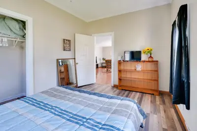 a bedroom with a bed and a dresser in it at Charming and Convenient Home in Butler