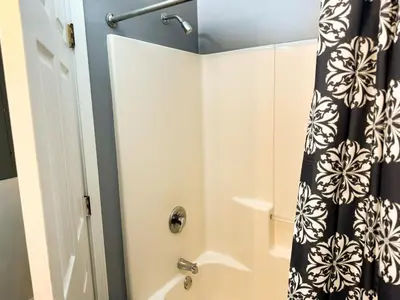 a bathroom with a shower with a shower curtain at Charming 2 Bedroom Loft in Cleveland