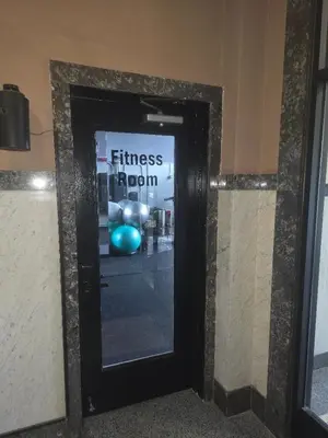 a door to a fitness room with a sign on it at Charming 2 Bedroom Loft in Cleveland