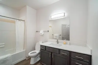 a white bathroom with a sink and a toilet at Landing Spectacular 2BD Clubhouse Pool in Cincinnati