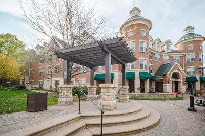 a large brick building with awning in front of it at Landing Spectacular 2BD Clubhouse Pool in Cincinnati