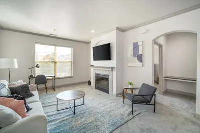 a living room with a couch and a fireplace at Landing Spectacular 2BD Clubhouse Pool in Cincinnati