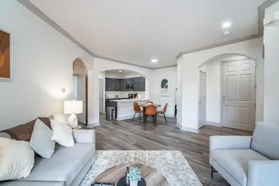 a living room with a couch and a table at Landing Spectacular 2BD Clubhouse Pool in Cincinnati