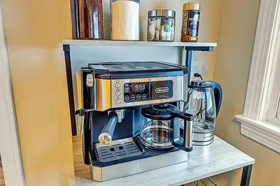 a coffee maker on a shelf in a kitchen at South Euclid 3BR Cozy Winter Escape in South Euclid