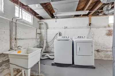 a room with two refrigerators and a sink in it at South Euclid 3BR Cozy Winter Escape in South Euclid