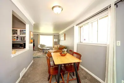 a dining room with a table and chairs in a room at Maple Heights 3BR Cozy and Spacious in Maple Heights