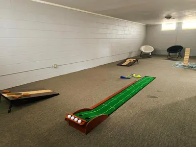 a room with a green track on the floor at Maple Heights 3BR Cozy and Spacious in Maple Heights