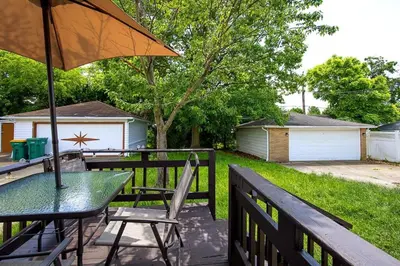 a patio with a table and an umbrella at Maple Heights 3BR Cozy and Spacious in Maple Heights