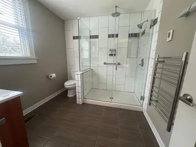 a bathroom with a shower and a toilet at Bexley Bed and Breakfast in Columbus