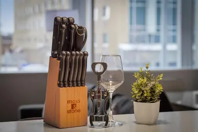 a knife block and a wine glass on a table at Spacious 2 BD Apt l Downtown Cleveland l Free Parking in Cleveland