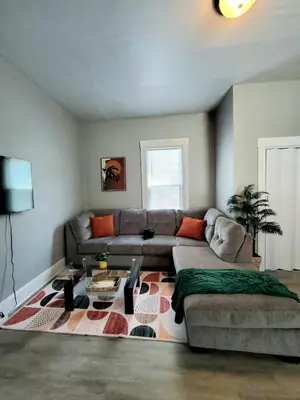 a living room with a couch and a table at Cozy 2BR, Near Top attractions in Covington