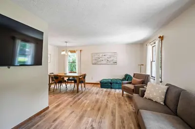 a living room with a couch and a table at The Family Nook - Home for 8 in Hamilton