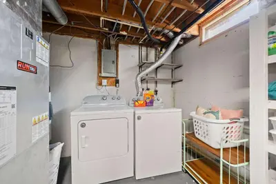 a laundry room with a washer and dryer at The StayBerry - Stay for 6 in Columbus