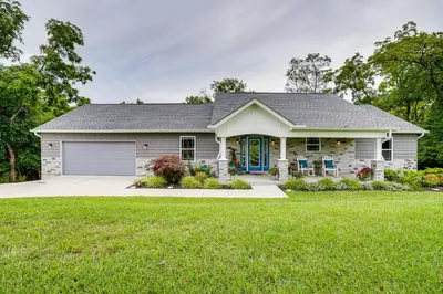 a house with a green lawn at 4 Mi to Dtwn Ohio River Valley Home with Deck! in Aurora