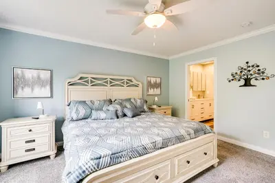 a bedroom with a bed and a ceiling fan at 4 Mi to Dtwn Ohio River Valley Home with Deck! in Aurora