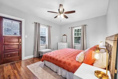 a bedroom with a bed and a ceiling fan at Suite Dreams Cleveland in Shaker Heights