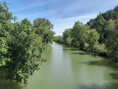a river with trees on both sides of it at River's Rest on Hocking River in Coolville