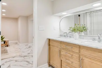 a bathroom with a sink and a mirror at Farmhouse Fresh 4BR Retreat in University Heights