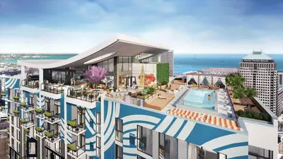 an aerial view of a building with a swimming pool at 5 Brand new combined apartments with city views in Cleveland