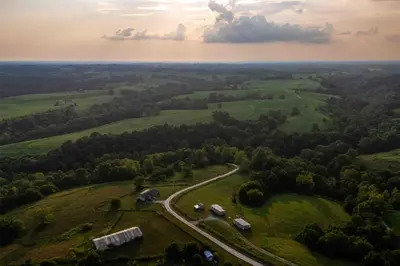 an aerial view of a green field with a road at Rustic Mt Sterling Cabin2 Near Downtown Pets OK in Mount Sterling