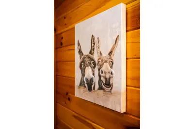 a picture of three dogs hanging on a wall at Rustic Mt Sterling Cabin2 Near Downtown Pets OK in Mount Sterling